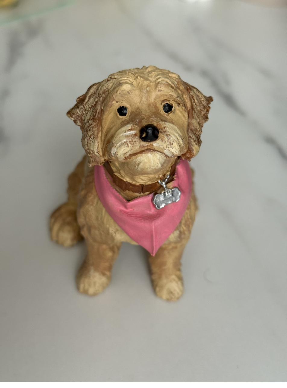 Artist painting pet sculpture